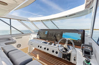Wide view of a luxury boat cockpit with integrated wireless phone charging