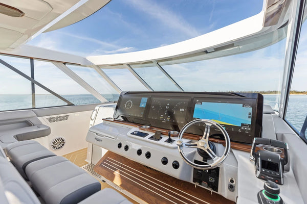 Wide view of a luxury boat cockpit with integrated wireless phone charging
