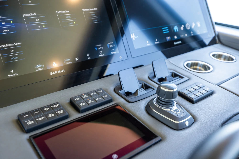 Multiple Aura wireless chargers installed on a modern boat helm dashboard