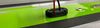 Cable seal installed on a glossy surface with black and red wiring