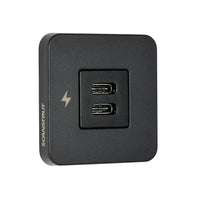 Angle view of black dual USB-C charging socket with square bezel and charging icon
