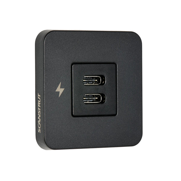 Angle view of black dual USB-C charging socket with square bezel and charging icon