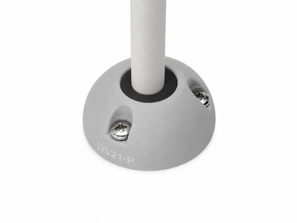 Grey vertical cable seal installed with white cable on a flat surface