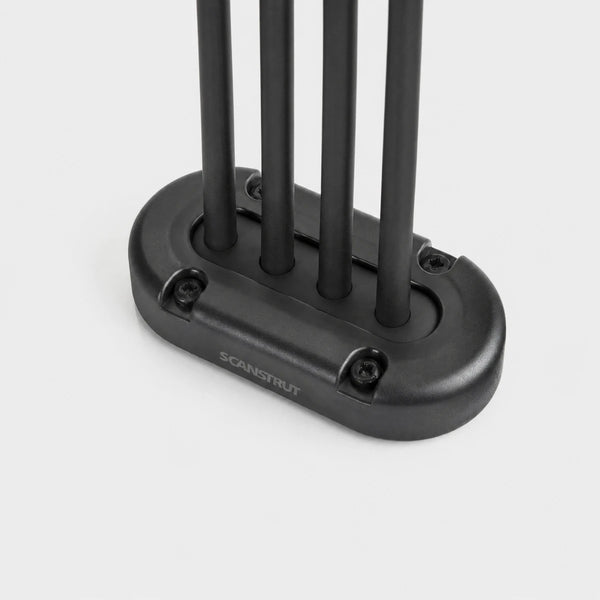 Black multi cable seal with four black cables passing through a vertical waterproof entry