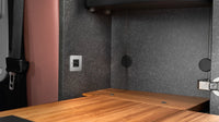 Installed TILE USB socket on a textured interior panel of a van