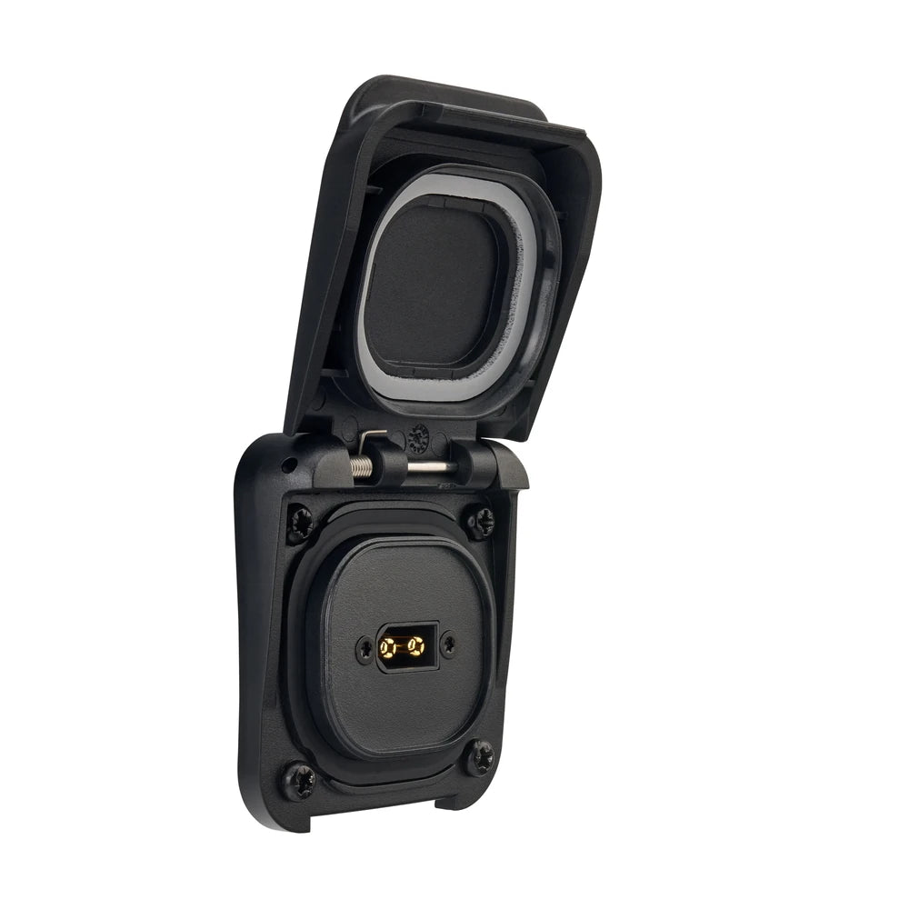 Three-quarter view of black Scanstrut solar input socket with open lid revealing internal XT60 connector
