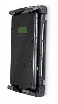 Profile view of a charging phone in a wall-mounted waterproof cradle