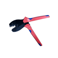 Open solar connector crimping tool displaying jaw alignment and ergonomic handle grip