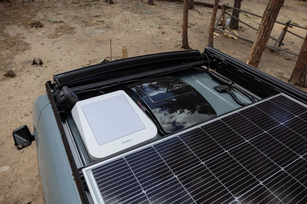 Overview of a van roof featuring solar panels and Scanstrut cable management