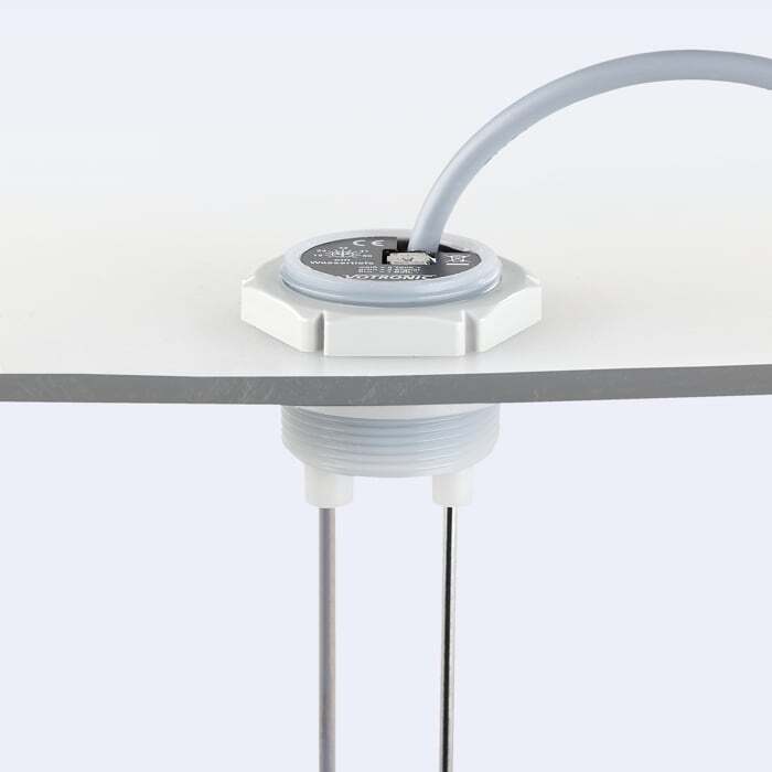 Close-up of electrode probe mounted through tank top with seal and nut
