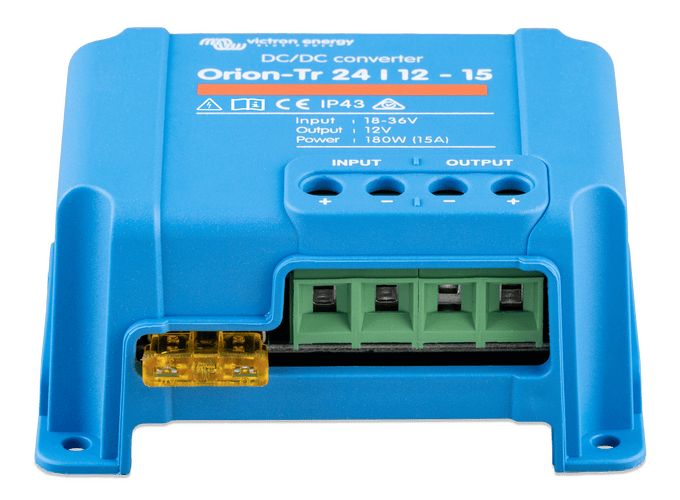 Detail view of the green terminal block and yellow blade fuse for circuit protection