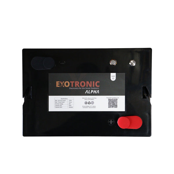 Overhead flat lay of 48V battery top panel showing terminals and power switch