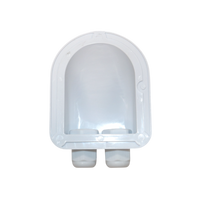 Underside view of white cable entry housing showing hollow interior and wide surface area for adhesive application
