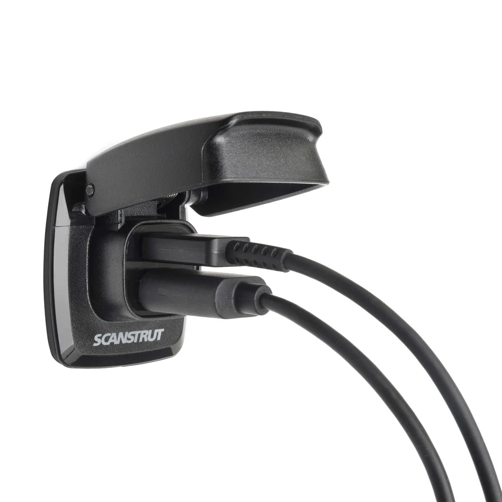 Dual USB socket with two cables plugged in under the protective flip lid