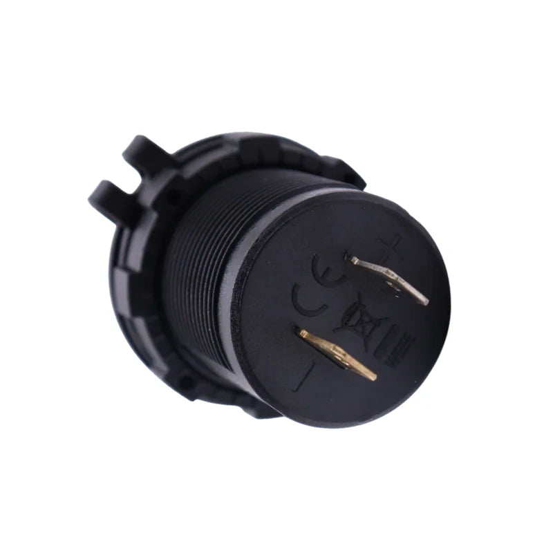 Rear view of socket housing showing positive and negative spade terminals and markings