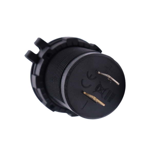 Rear view of socket housing showing positive and negative spade terminals and markings