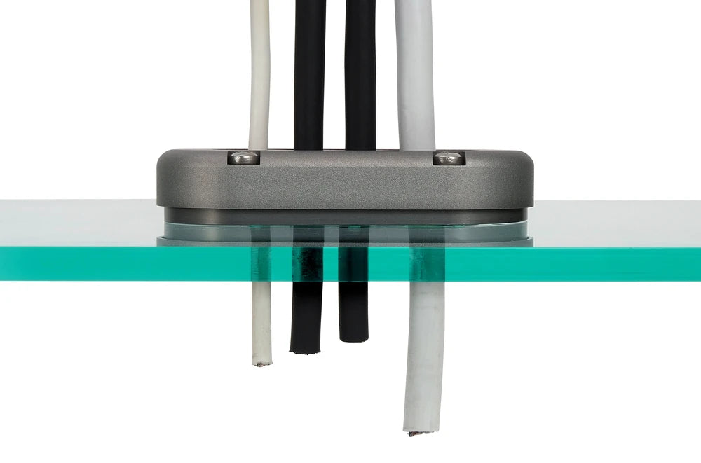 Side view of the cable seal installed on a transparent surface showing the internal seal