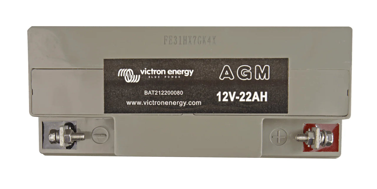 Top-down view of Victron AGM battery showing positive and negative screw terminals and polarity markings