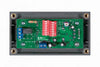 Internal view of battery alarm showing PCB with DIP switches and terminal blocks