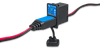 Victron battery indicator panel with status LEDs and charging cable plugged into the interface