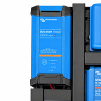 Close-up of the Victron Blue Smart 12V 30A charger on a black mounting board
