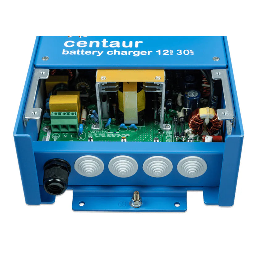 Internal view of battery charger showing AC input terminals and cable entry points