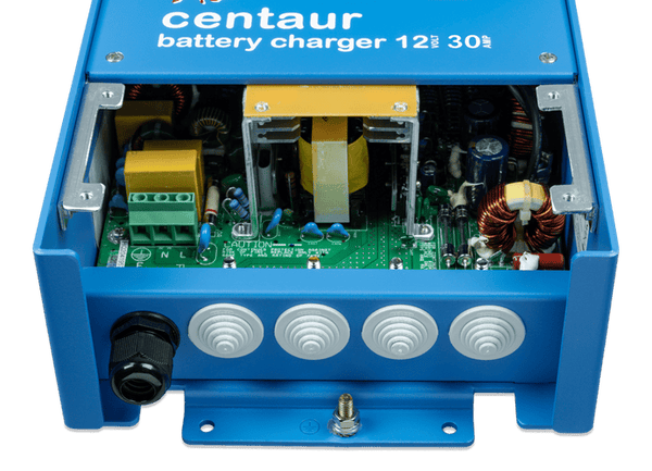 Internal view of battery charger showing AC input terminals and cable entry points
