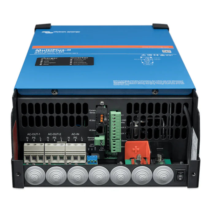 Internal view of MultiPlus-II connection compartment showing AC terminals, DC bolts, and communication ports