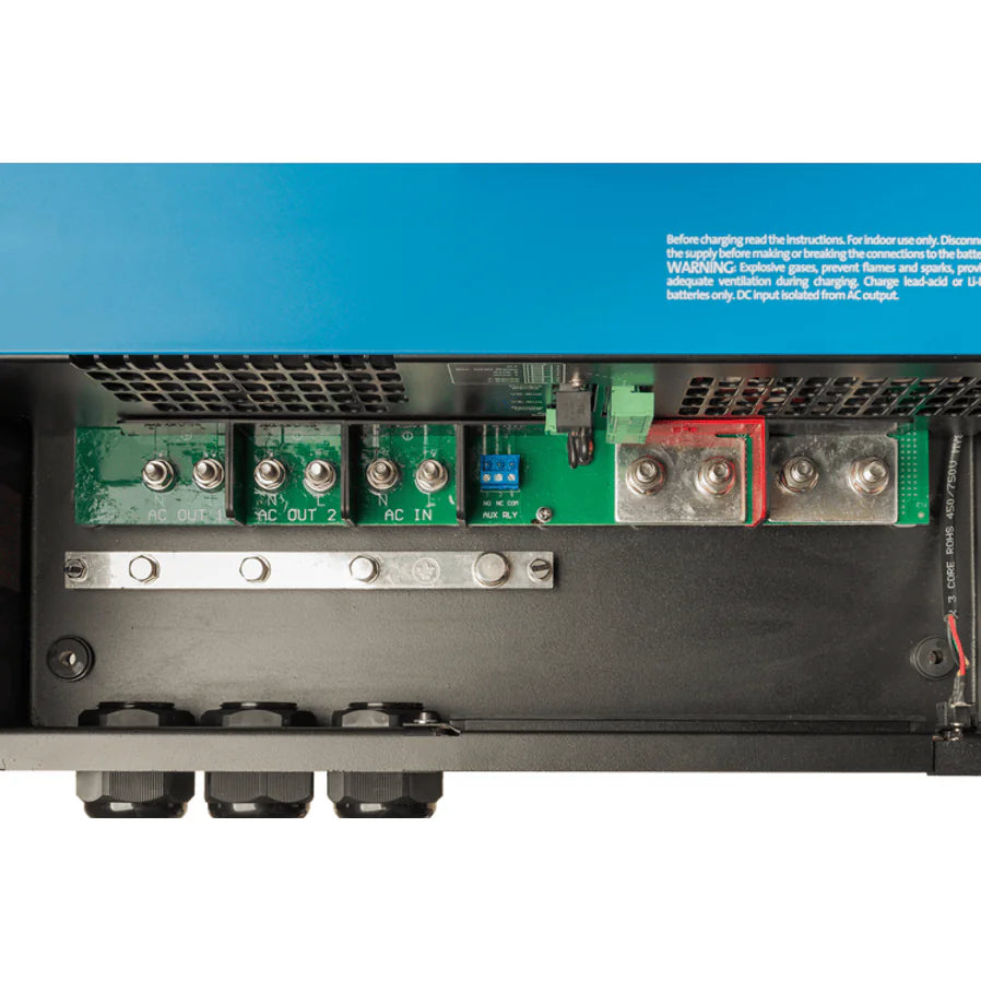 Top-down close-up of labeled internal AC input and output screw terminals