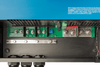 Top-down close-up of labeled internal AC input and output screw terminals