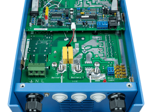 Internal view of Victron Phoenix 12/30 charger showing PCB and output terminals