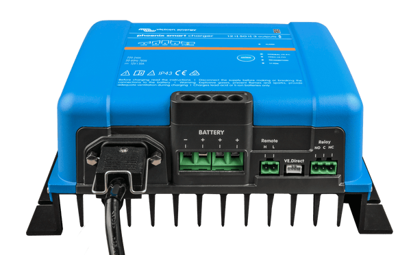 Connection panel of a Victron battery charger showing AC input and DC output terminals