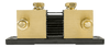 Close-up side view of the 2000A SmartShunt cooling fins between two large brass terminal blocks