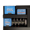 Close-up detail of Victron SmartSolar MPPT, Cerbo GX and Orion XS mounted on black board