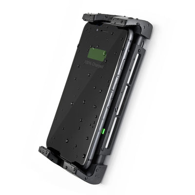 Smartphone charging in waterproof cradle with water droplets on screen