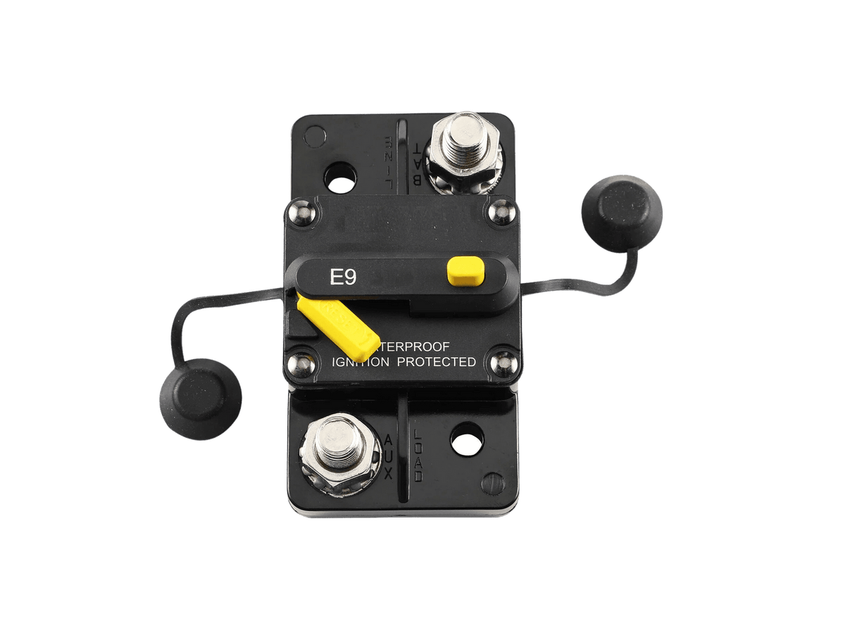 Top view of circuit breaker with caps removed exposing stainless steel studs