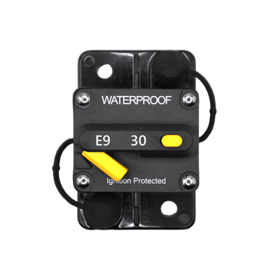 Top view of 30A waterproof circuit breaker with yellow reset lever and protective caps