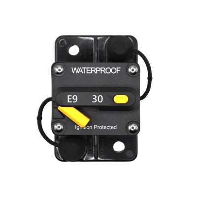 Top view of 30A waterproof circuit breaker with yellow reset lever and protective caps
