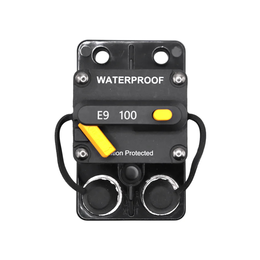 Top-down view of 100A waterproof circuit breaker with rubber stud covers installed