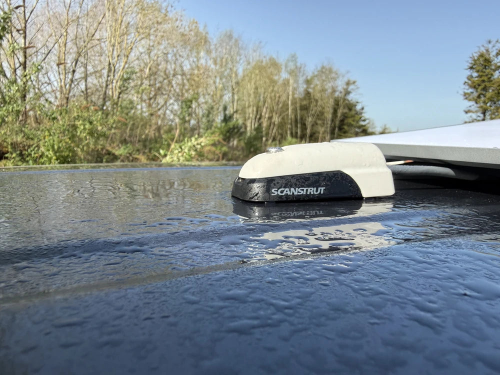 Waterproof cable seal on a wet textured surface demonstrating IP68 protection