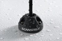 Water droplets on a black Scanstrut cable seal demonstrating its waterproof rating