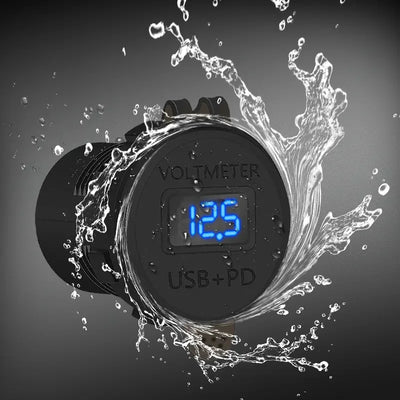 Water splashing around the socket with closed dust cover, showing the blue voltage reading through the clear window