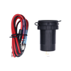 Socket with closed protective cap lying next to the coiled red and black wiring harness